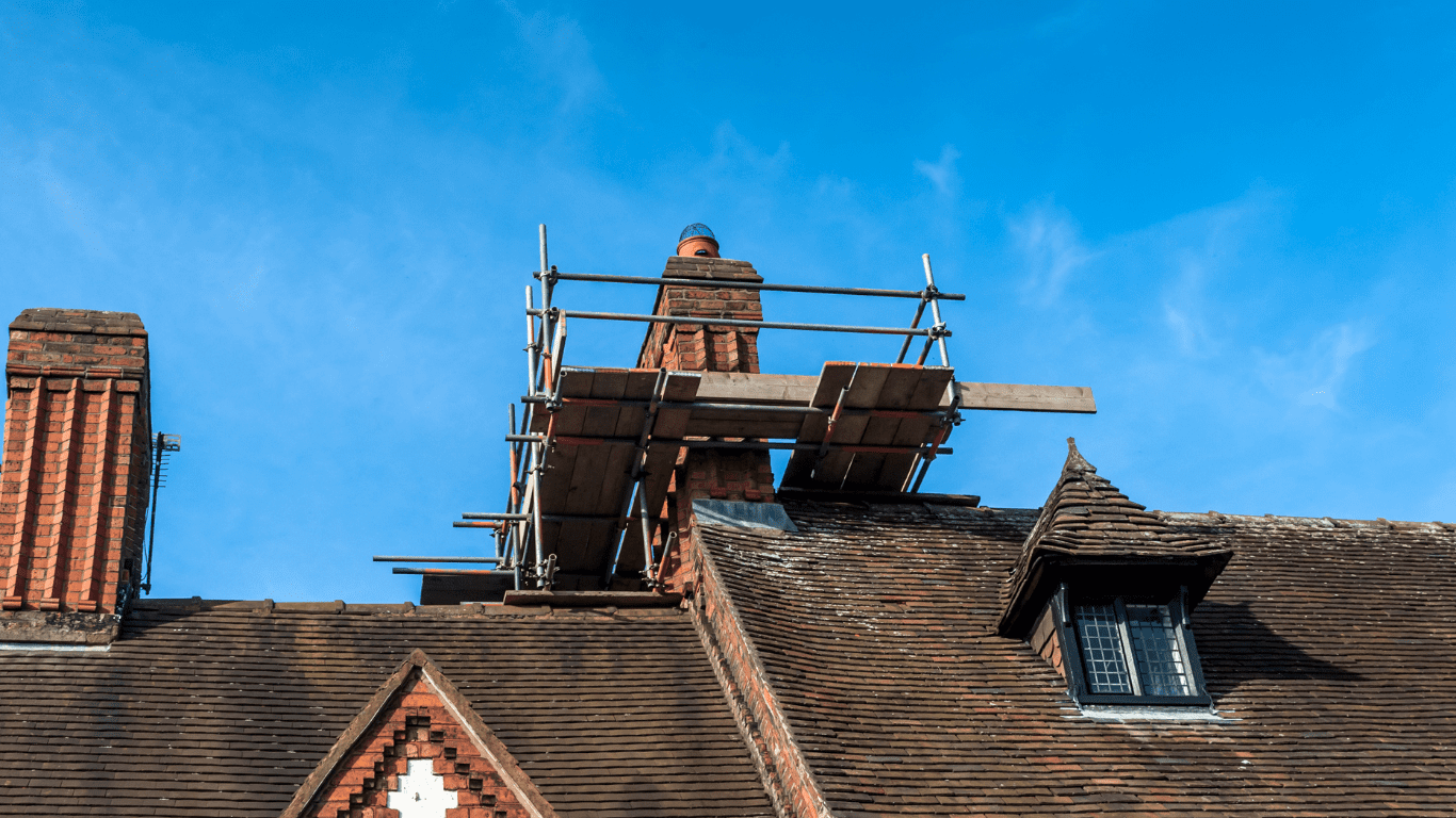 scaffolding surrounding a chimney on a home near London, ON